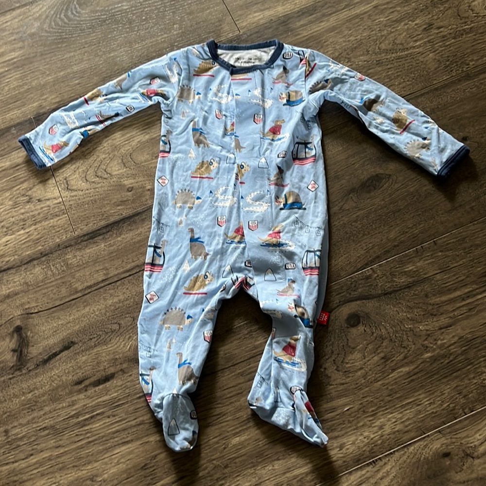 Magnetic Me footie pajamas with skiing dinosaur design